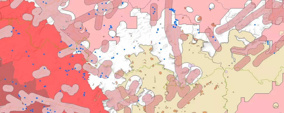 Ein Kartenausschnitt mit vielen unterschiedlich eingefärben Layern und blauen Punkten